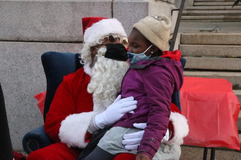 Santa Rides Through the City on a Trenton Fire Department Truck